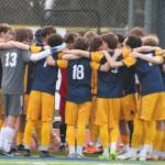 The Bainbridge Spartans huddle up before their home match against Port Angeles March 20.