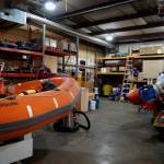 Repairs and maintenance are performed on rescue boats at the facility.