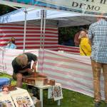 A pottery wheel demonstration was one of many booths at the carnival.