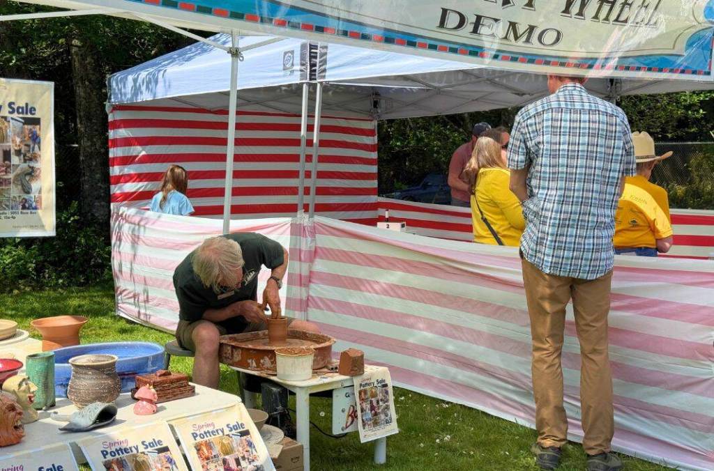 A pottery wheel demonstration was one of many booths at the carnival.