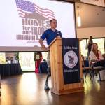 Captain Tim Bomke speaks to a crowd of about 120 during the welcoming ceremony in November 2025.