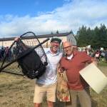 Attendees stand with their Rotary Auction finds.