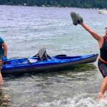Katherine Bouma/Kitsap News Group photos
Jessica Dubey finishes her swim with David Goldberg in a kayak alongside her.